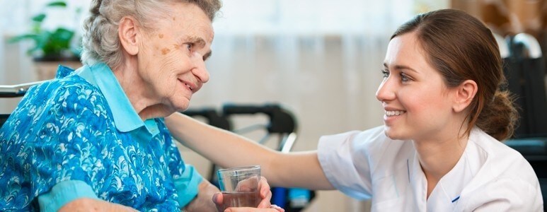 Care giver letting a resident do what is familiar Care giver letting a resident do what is familiar