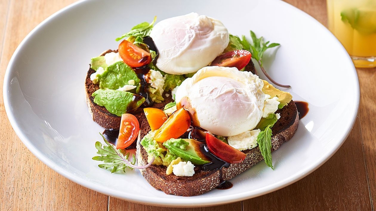 Avocado and Feta Smash on Rye with Poached Eggs and Balsamic Glaze