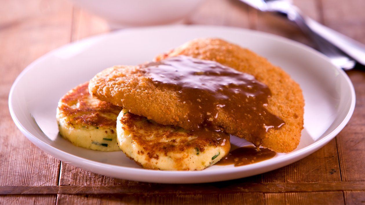 Crispy Chicken Schnitzel, Potato, Cheese and Chive Cakes, Roasted Garlic Sauce – Recipe